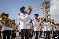 FILE - A band plays at a demonstration supporting a resolution to allocate 13 seats to the Banadir region, which encompasses the capital, in effect expanding the Senate, in Mogadishu, Somalia, Jan. 29, 2021.