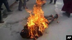 This still image allegedly shows the self-immolation of an individual along a street in Dawu, Ganzi prefecture in Sichuan province.