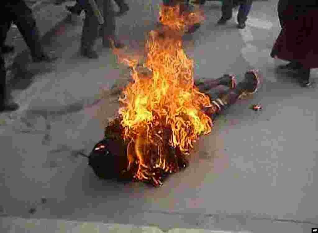 This still image allegedly shows the self-immolation of an individual along a street in Dawu, Ganzi prefecture in Sichuan province. The dramatic video footage, could not be independently verified, purportedly captures the moment a Tibetan Buddhist nun bur