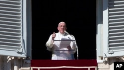 Pope Francis delivers a message during his Angelus prayer from his studio window overlooking St. Peter's Square, at the Vatican, Nov. 8, 2015. Pope Francis told followers that the theft of Vatican documents describing financial malfeasance inside the Holy See was a "crime" but pledged to continue reforms. 