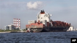 Commerce department report indicates U.S. businesses boosted inventory to spur better-than-expected growth. Above, a container ship on its way to unload its cargo at Port Everglades in Fort Lauderdale, Florida, Sept. 27, 2012.