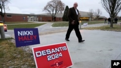 An audience member arrives at Dordt University in Sioux Center, Iowa, to see three candidates for the Republican nomination for U.S. president, on Dec. 9, 2023.