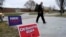 An audience member arrives at Dordt University in Sioux Center, Iowa, to see three candidates for the Republican nomination for U.S. president, on Dec. 9, 2023.