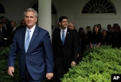 House Majority Leader Kevin McCarthy of California, followed by House Speaker Paul Ryan of Wisconsin, and House Majority Whip Steve Scalise of Louisiana, arrive in the Rose Garden of the White House in Washington, May 4, 2017, after the House pushed through the health care bill.