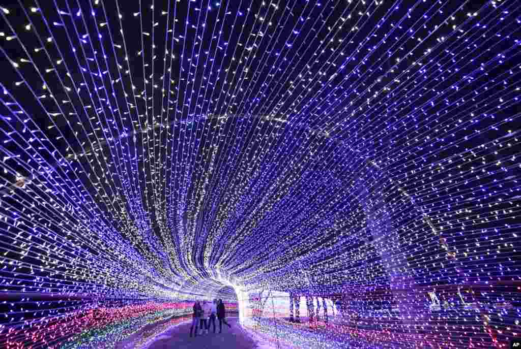 Women take a selfie inside the light composition in the park in Minsk, Belarus.