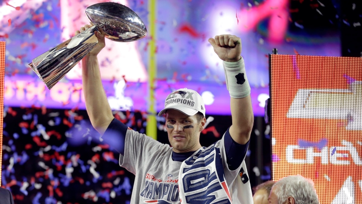 Feb 1, 2015; Glendale, AZ, USA; New England Patriots quarterback Tom Brady  (12) celebrates after throwing a touchdown pass against the Seattle Seahawks  in the second quarter in Super Bowl XLIX at …