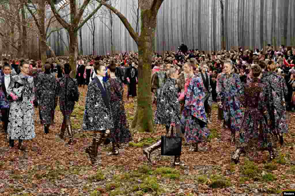 Models present creations by German designer Karl Lagerfeld as part of his Autumn/Winter 2018-2019 women's ready-to-wear collection show for fashion house Chanel at the Grand Palais during Paris Fashion Week, France.