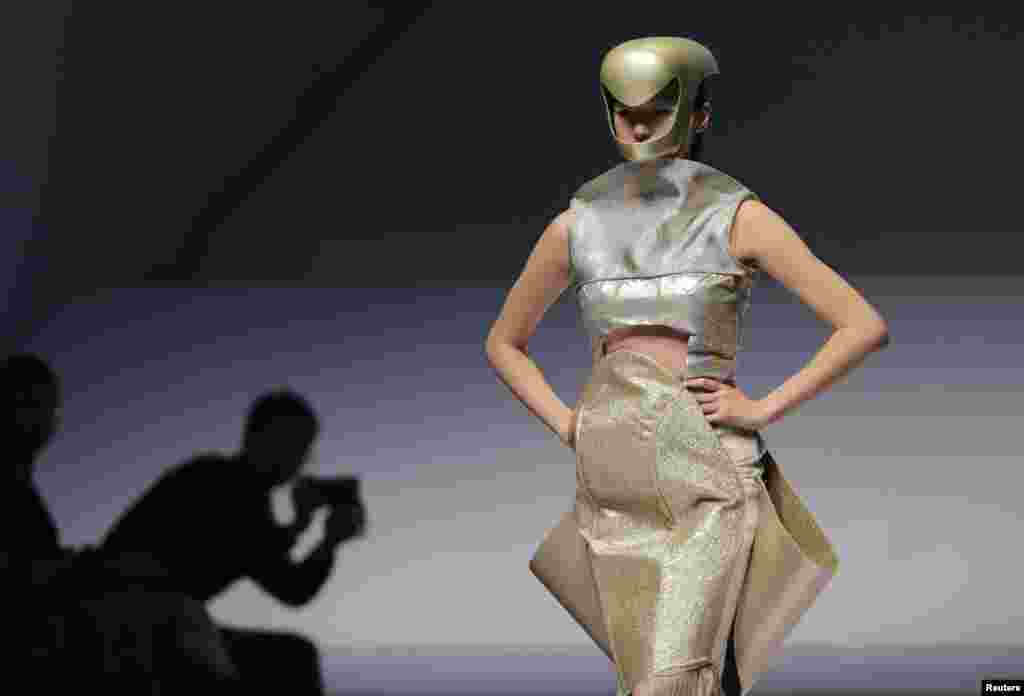 A model presents a creation for the Hempel Award 21st China International Young Fashion Designers Contest, at China Fashion Week in Beijing. 