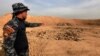 Rights Group: Islamic State Filled Grave with Former Policemen 