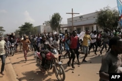 FILE - Several hundred of people protest their exclusion from the presidential election in Beni, Democratic Republic of Congo, Dec. 28, 2018.