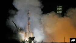 The Soyuz-FG rocket booster with Soyuz TMA-12M space ship carrying a new crew to the International Space Station (ISS) blasts off at the Russian leased Baikonur cosmodrome, Kazakhstan, March 26, 2014.