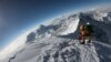 FILE - Mountaineers make their way to the summit of Mount Everest, as they ascend on the south face from Nepal, May 17, 2018.