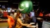 An employee works at the control room of the Geo News television channel in Karachi, Pakistan, April 11, 2018. 