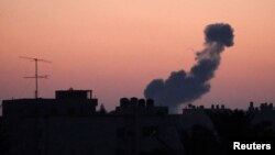 Smoke rises following an Israeli airstrike in the central Gaza Strip, June 20, 2018. 