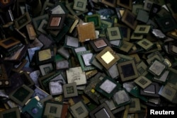 FILE - CPU chips are seen at a recycling facility. President Donald Trump blocked the sale of computer chip maker Lattice Semiconductor Corp. to a Chinese company, calling it a threat to national security.