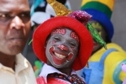 A clown is seen on the streets of Harare in this Saturday, Dec. 21, 2019, photo. Zimbabwe faces Christmas amid a harsh economic crisis that has forced many people to queue for cash and for fuel, making it difficult to plan for the festive period.(AP)