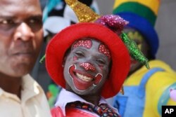 A clown is seen on the streets of Harare in this Saturday, Dec. 21, 2019, photo. Zimbabwe faces Christmas amid a harsh economic crisis that has forced many people to queue for cash and for fuel, making it difficult to plan for the festive period.(AP)