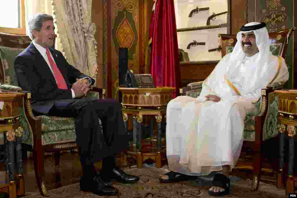 U.S. Secretary of State John Kerry, left, meets with Qatari Emir Hamad bin Khalifa Al Thani at Wajbah Palace in Doha, Qatar, on Sunday, June 23, 2013. In Qatar Kerry spent time discussing Syria and Afghanistan. The meeting is the last event in Qatar befo