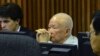 Khieu Samphan, center, former Khmer Rouge head of state, sits in a court room of the U.N.-backed war crimes tribunal, in Phnom Penh, Jan. 8, 2015.