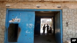 FILE - The entrance of Aden Central Prison, known as Mansoura, where one wing is run by Yemeni allies of the United Arab Emirates to detain al-Qaida suspects, is shown in this May 9, 2017 photo in Aden, Yemen. 