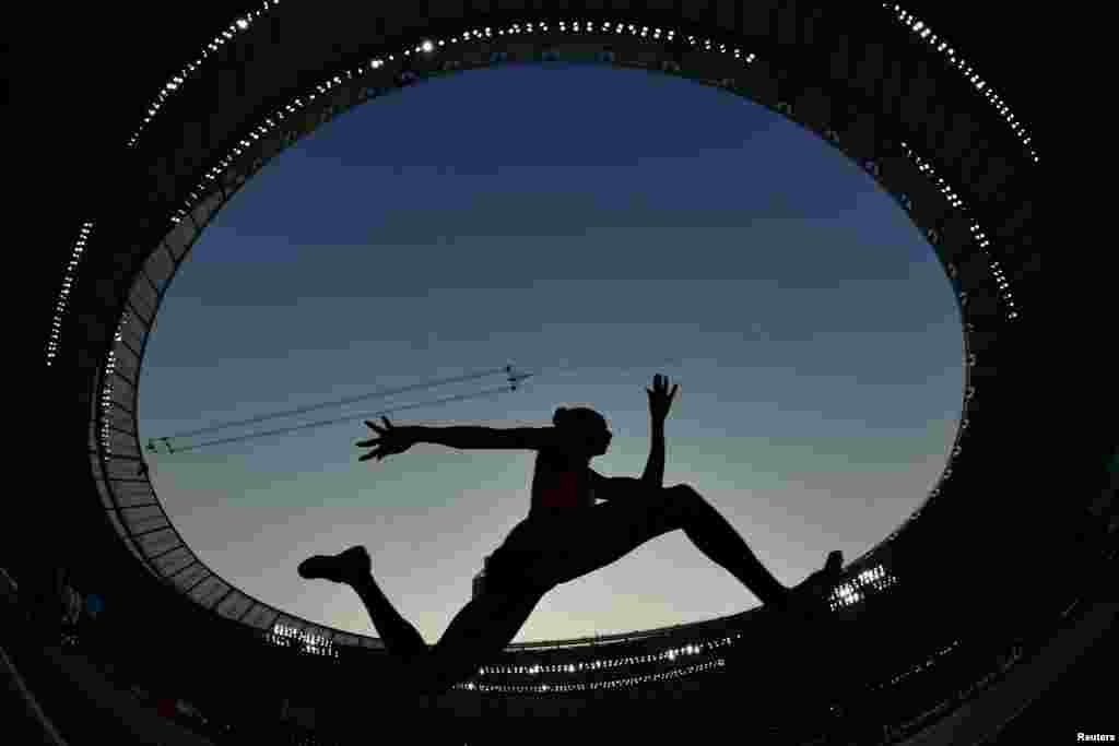 An athlete competes in the Women&#39;s Triple Jump Qualification at the 2019 IAAF Athletics World Championships at the Khalifa International stadium in Doha, Qatar.