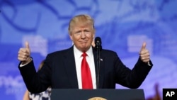 President Donald Trump gives thumbs up as he arrives to speak at the Conservative Political Action Conference, Feb. 24, 2017, in Oxon Hill, Maryland.