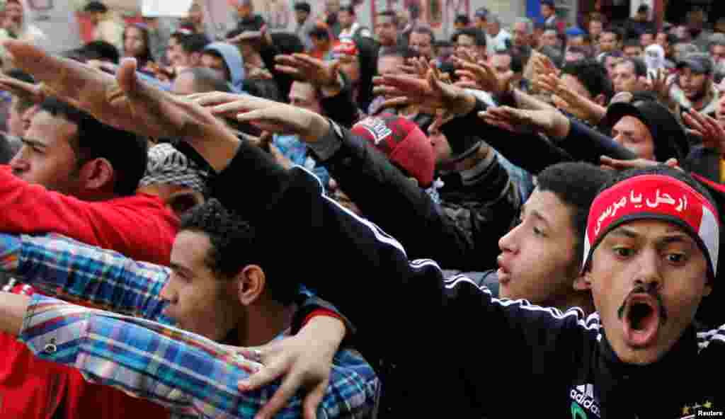 Protesters shout slogans in a march during the second anniversary of the resignation of Hosni Mubarak, at Tahrir Square in Cairo, February 11, 2013. 