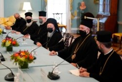 Ecumenical Patriarch Bartholomew I, center, the spiritual leader of the world's Orthodox Christians, speaks during a meeting with Secretary of State Antony Blinken, Oct. 25, 2021, at the U.S. State Department in Washington.