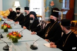 Ecumenical Patriarch Bartholomew I, center, the spiritual leader of the world's Orthodox Christians, speaks during a meeting with Secretary of State Antony Blinken, Oct. 25, 2021, at the U.S. State Department in Washington.