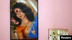 A portrait of Savita Halappanavar is seen on the wall of her parents' home in Belgaum in the southern Indian state of Karnataka, November 16, 2012. 