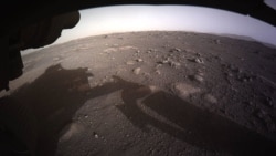 NASA released this photo as the first high-resolution, color image to be sent back by the Hazard Cameras (Hazcams) on the underside of the Perseverance rover after its landing on Mars. (NASA)
