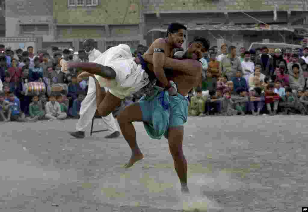 Wrestlers compete in an ancient Sindhi form of wrestling called &quot;Malakhra&quot; in Karachi, Pakistan.