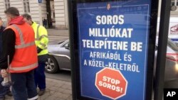 FILE - A poster in Budapest reads 'Soros would settle millions from Africa and the Middle East. Stop Soros!,' Feb. 1, 2018. The proposed constitutional change targets civic groups, some of which are supported by Hungarian-American financier George Soros.