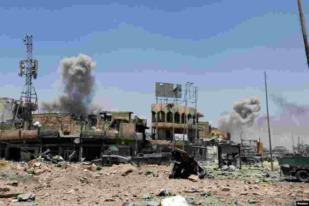 Smoke rises from an airstrike during a fighting with Islamic State militants in the Old City of Mosul, Iraq.