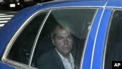 FILE - John Hinckley Jr. arrives at U.S. District Court in Washington, Nov. 18, 2003. The man who shot and wounded President Ronald Reagan in 1981 was freed from court oversight June 15, 2022, officially concluding decades of supervision by legal and mental health professionals. 