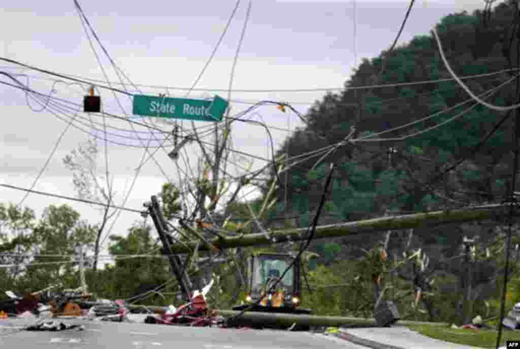 Workers use heavy machinery to clear power lines in Ringgold, Ga. Thursday, April 28, 2011, after a tornado hit the area Wednesday night. Seven people were killed in Georgia's Catoosa County, including Ringgold, where a suspected tornado flattened about a