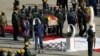 A coffin carrying the body of Zimbabwe's former ruler Robert Mugabe arrives from Singapore, at the RG Mugabe International Airport in Harare, Kenya. Wednesday Sept. 11, 2019. T
