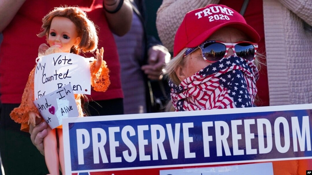 FILE - A supporter of President Donald Trump is seen during a rally in Milwaukee after it was announced that the president had been defeated by Democrat Joe Biden, Nov. 7, 2020.