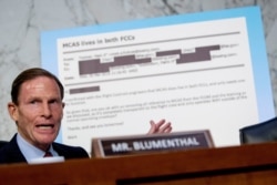 Rep. Richard Blumenthal, D-Conn., displays an email exchange behind him as he questions Boeing Company President and Chief Executive Officer Dennis Muilenburg as he testifies before a Senate committee hearing, Oct. 29, 2019.
