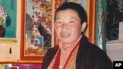 Tibetan nun Palden Chetso who died after setting herself on fire in southwestern China is seen in this undated file photo.