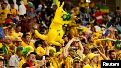 When it comes to soccer, many fans have a lot of skin in the game! Pictured here are Australian fans watching the match against Denmark during the World Cup in Qatar on November 30, 2022. (REUTERS/Hamad I Mohammed)