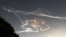 Smoke trails made by an Epsilon rocket are seen during the morning sunrise over Kimotsuki town in Kagoshima prefecture, Japan. The Epsilon rocket, carrying the ASNARO-2 radar satellite developed by NEC, was launched from the JAXA Uchinoura Space Center.