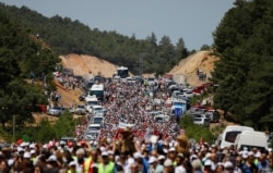 Environmental activists march to protest against what they say will be pollution from a foreign-owned gold mine project near the western town of Kirazli in Canakkale province, Turkey, Aug. 5, 2019.