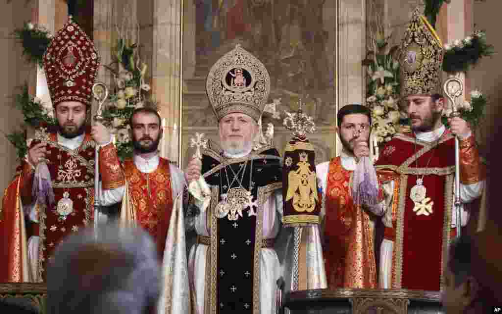 Armenian Orthodox pries Karekin II, center, conducts Christmas service in Echmiadzin about 24 km east of the capital Yerevan, Armenia, Friday, Jan. 6, 2012.  (AP)