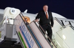 U.S. Secretary of State Mike Pompeo steps from a plane upon arrival in Tashkent, Uzbekistan, Feb. 2, 2020