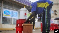 FILE - A man washes his hands to curb the spread of the new coronavirus in Juba, South Sudan, April 6, 2020. 