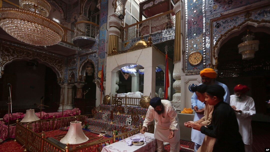 People from Pakistan Sikh community visit their temple in Peshawar, Pakistan, Aug. 8, 2017. Today Sikhs are battling with the Pakistan government for ownership of dozens of Sikh temples that they call gurdwaras and while it is slow going they have managed to reclaim some of their temples. Many were abandoned in 1947 and taken over by Muslims who arrived from India. The Pakistan government, which took over the buildings after 1947, allowed the squatters to remain. 