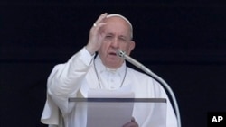 Pope Francis delivers his message during the Angelus noon prayer in St. Peter's Square at the Vatican, Aug. 4, 2019.