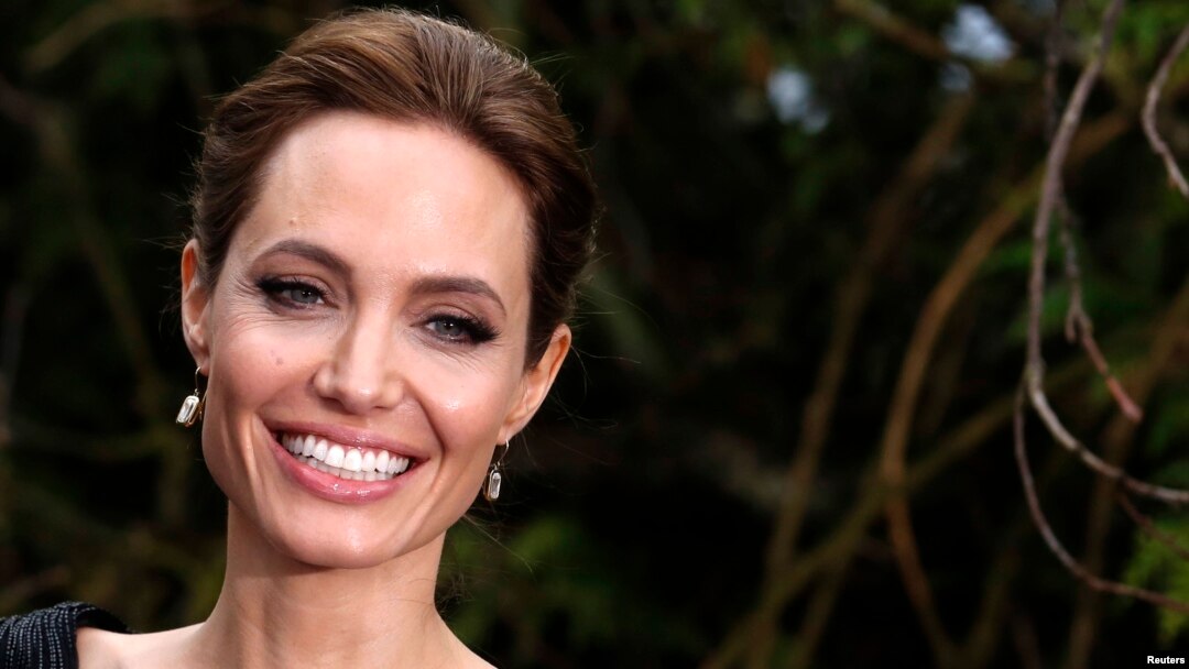 FILE - Actress Angelina Jolie arrives for a special Maleficent Costume Display at Kensington Palace in London, May 8, 2014. 
