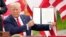 President Donald Trump holds a signed memorandum to expand the offshore drilling moratorium to Florida's Atlantic coast, Georgia and South Carolina after speaking on Sept. 8, 2020, in Jupiter, Fla. 
